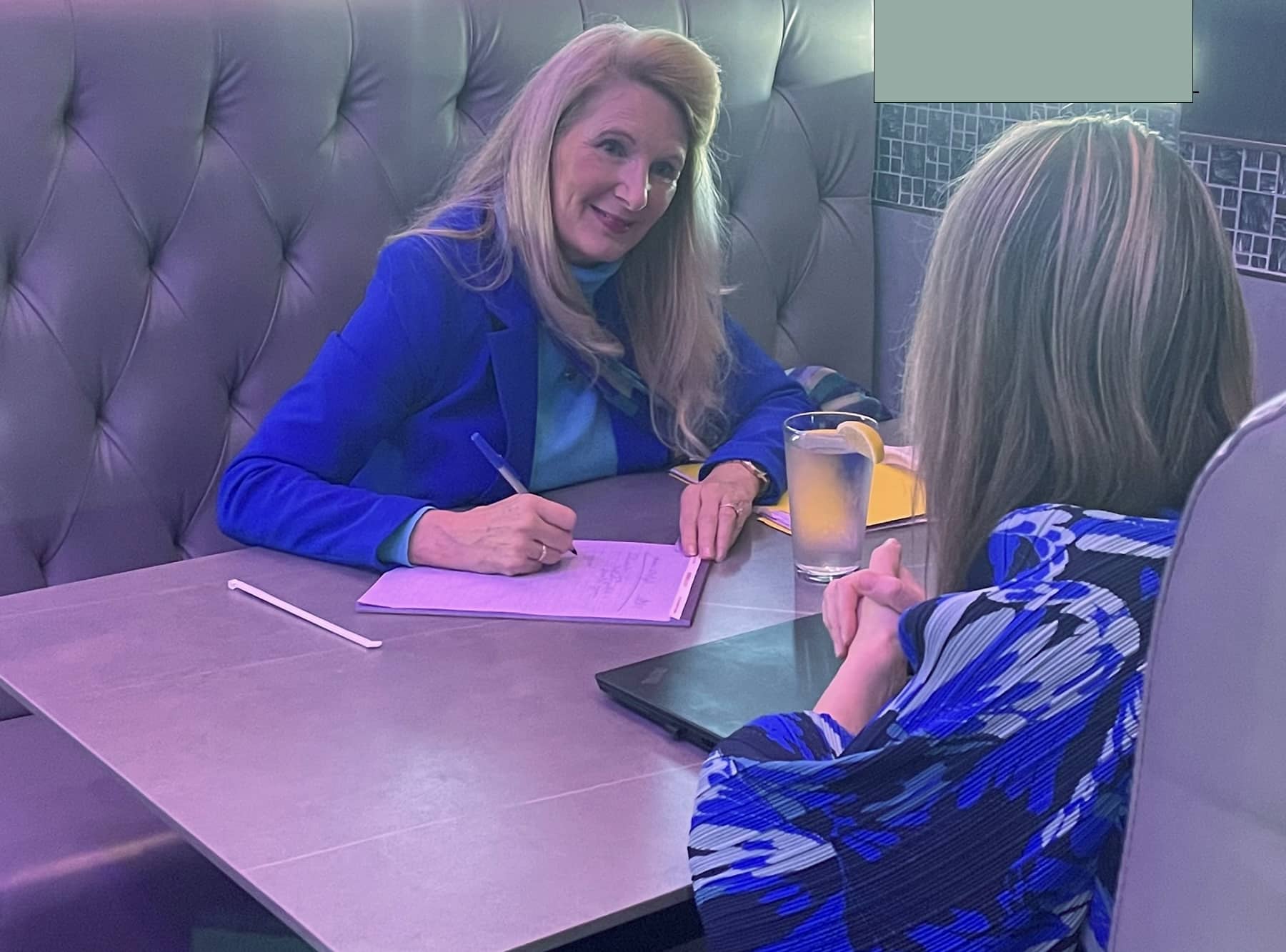 Snowden McFall conducting a personalized pre event interview, gathering insights from an organizational leader to tailor a custom keynote presentation.